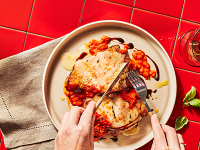 Chicken parmesan with tomato sauce and melted cheese